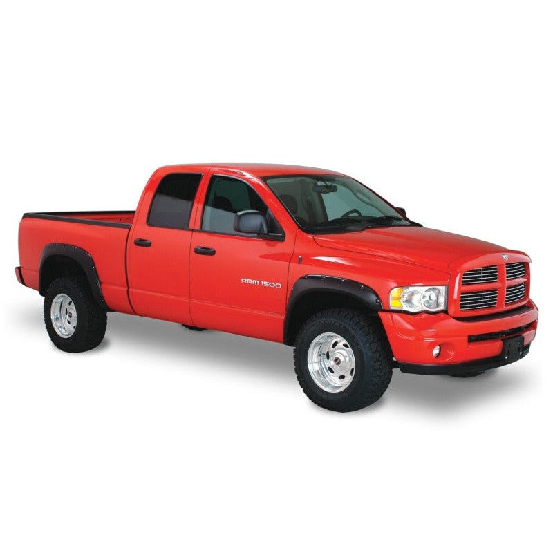 Four black Husky Liners Pocket Style fender flares with stainless steel rivets for 2006-2009 Dodge Ram trucks.