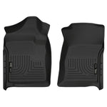 A pair of black Husky Liners WeatherBeater front floor liners for 2007-2014 Chevrolet Silverado and GMC Sierra Regular Cab.