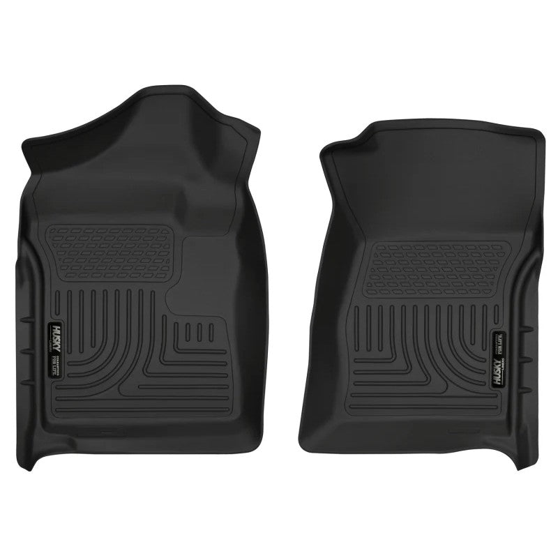 A pair of black Husky Liners WeatherBeater front floor liners for 2007-2014 Chevrolet Silverado and GMC Sierra Regular Cab.
