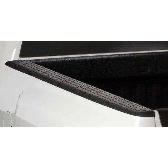 Black Husky Liners QuadCaps custom-molded truck bed rail caps showing the removable stake-hole covers.