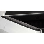 Husky Liners QuadCaps textured black truck bed rail caps with removable stake pocket covers.
