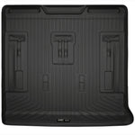 Black Husky Liners WeatherBeater cargo liner for GM SUVs featuring a textured non-slip surface and raised containment edges.