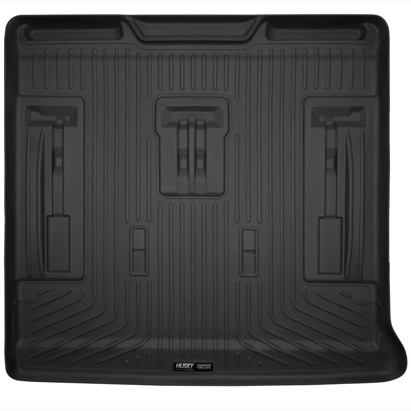 Black Husky Liners WeatherBeater cargo liner for GM SUVs featuring a textured non-slip surface and raised containment edges.