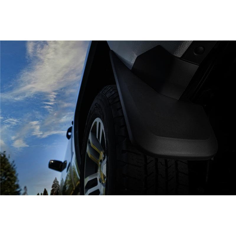 Black Husky Liners custom-molded rear mud guards for 2009-2024 Dodge Ram trucks with factory fender flares.