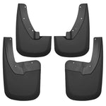 Four black Husky Liners FormFit mud guards for front and rear wheel wells of a Dodge Ram truck.