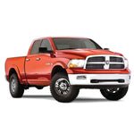 Four-piece set of Husky Liners Extend-A-Fender Flares in smooth matte black for 2009-2024 Dodge and Ram 1500 trucks.