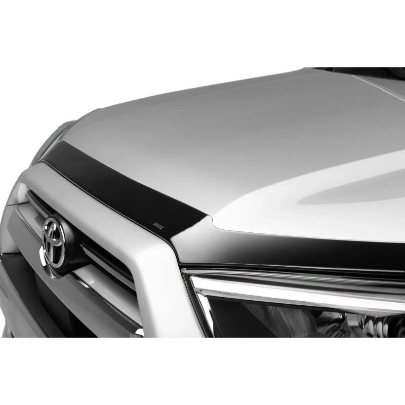 Smoke finish Husky Liners Aeroskin hood protector mounted on the front edge of a Toyota 4Runner hood.