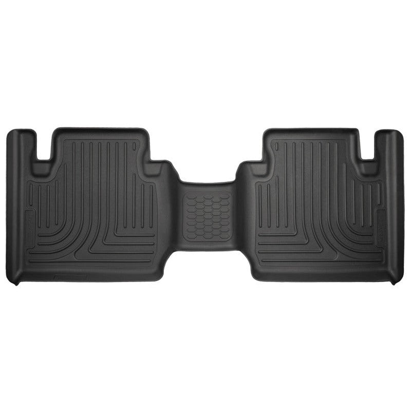 Black Husky Liners WeatherBeater second row floor liners for 2012-2023 Toyota Tacoma showing StayPut Cleats and raised edges.