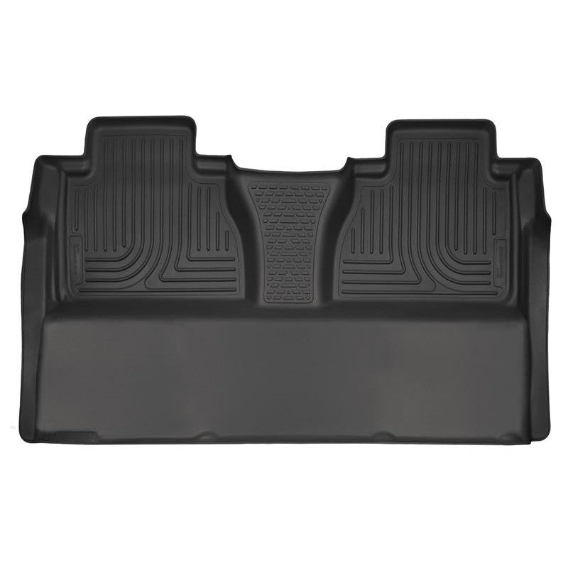 Black Husky Liners Weatherbeater 2nd row floor liner for Toyota Tundra featuring raised edges and StayPut Cleats.