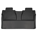 Black Husky Liners Weatherbeater 2nd row floor liner for Toyota Tundra featuring raised edges and StayPut Cleats.