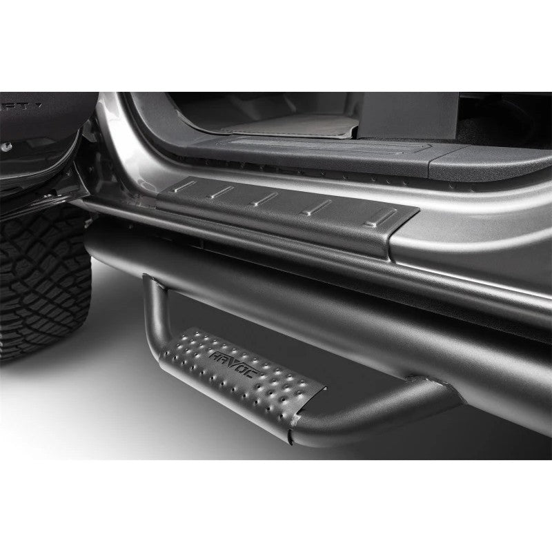 Four-piece set of textured black Husky Liners Trail Armor rocker panel and sill plate covers.