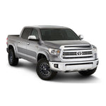 Matte black Husky Liners Pocket Style Fender Flares with stainless steel rivets installed on a 2014-2021 Toyota Tundra.