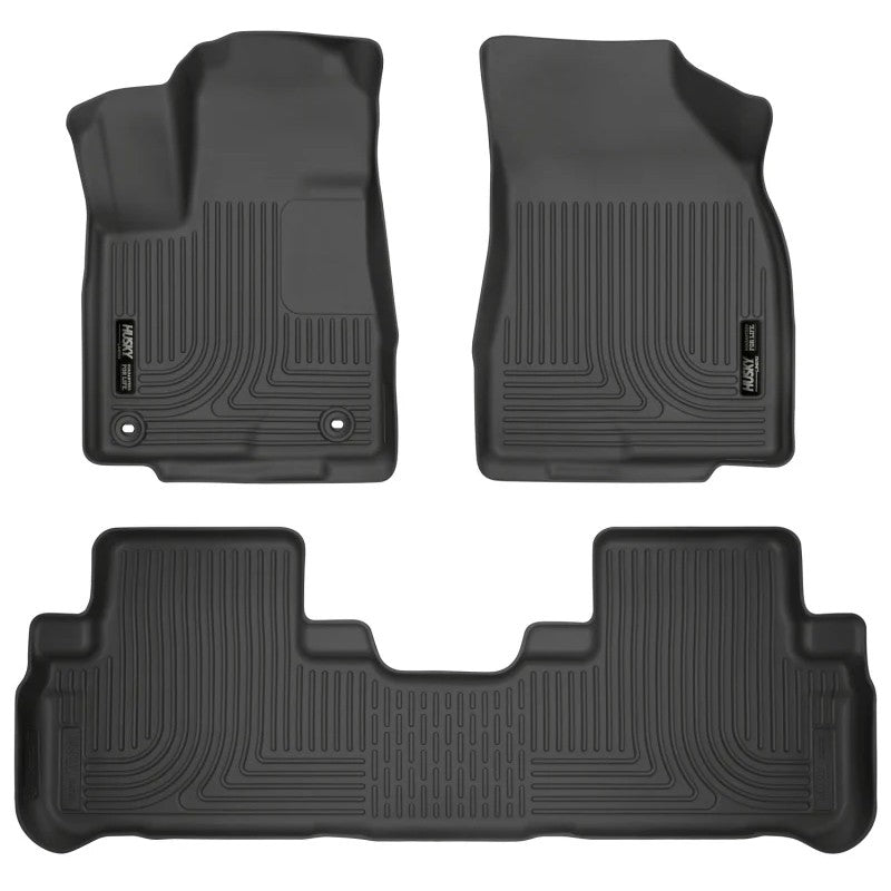 Black Husky Liners Weatherbeater floor mats for 2014-2019 Toyota Highlander front and second row seating areas.