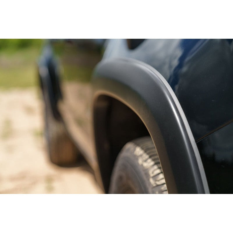 Four-piece set of smooth matte black Husky Liners OE style fender flares for 2015-2020 Chevrolet Colorado.