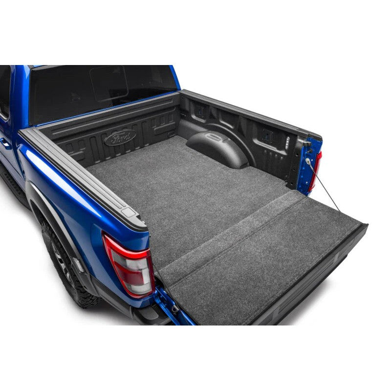 Husky Liners Guardian Comfort grey textured bed and tailgate mat installed in a 2015-2026 Ford F-150 truck bed.