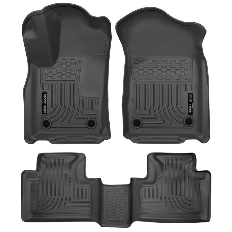 Black Husky Liners Weatherbeater front and second row floor mats for Dodge Durango and Jeep Grand Cherokee.