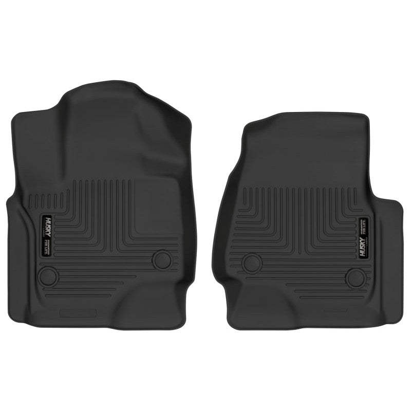 A pair of Husky Liners X-act Contour black rubberized front floor liners with raised containment edges and stay-put nibs.