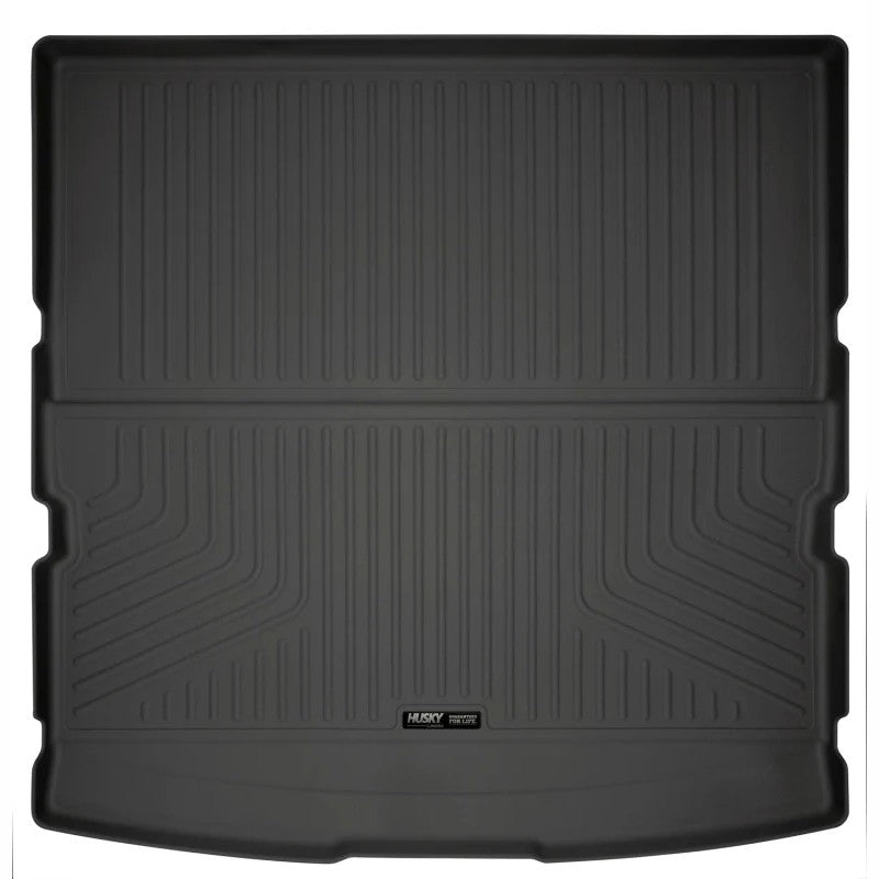 Black Husky Liners WeatherBeater rear cargo liner with raised spill-containment edges and StayPut cleats.