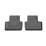 Black Husky Liners X-act Contour second-row floor liner featuring a textured DuraGrip surface and raised edges.