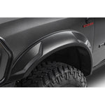 Set of four smooth matte black Husky Liners DRT Style fender flares for 2019-2026 Ram 2500 and 3500 trucks.