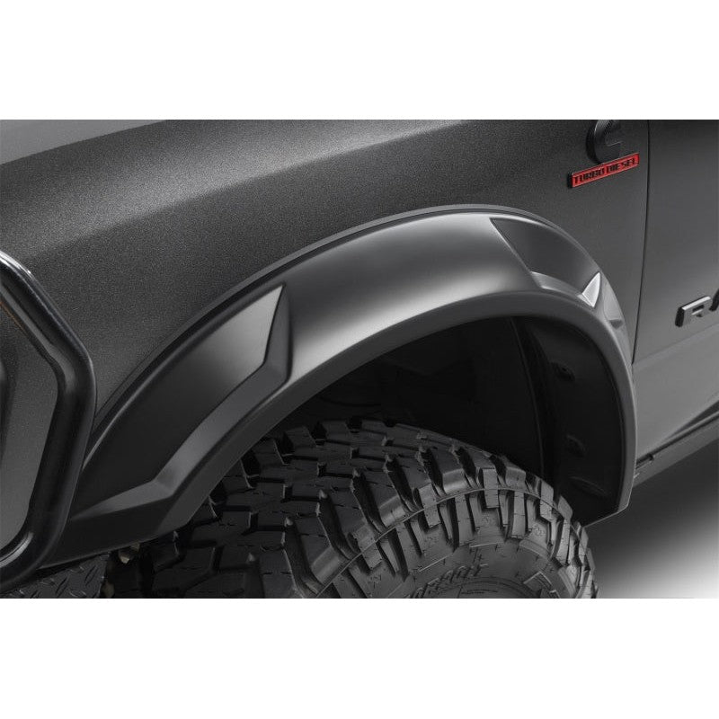 Set of four smooth matte black Husky Liners DRT Style fender flares for 2019-2026 Ram 2500 and 3500 trucks.