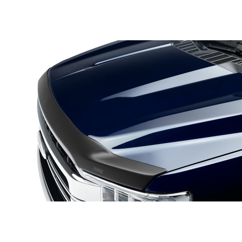 Smoke finish Husky Liners Aeroskin Hood Protector mounted on the hood of a GMC Sierra 1500 truck.