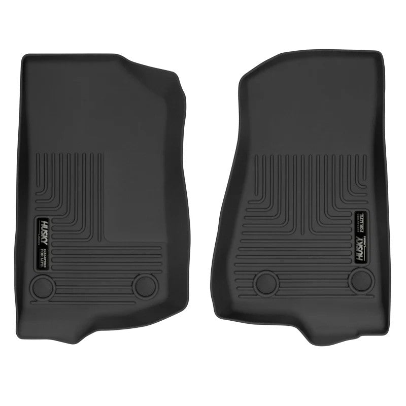 Pair of black Husky X-act Contour front floor liners with textured DuraGrip surface and raised spill-containment edges.