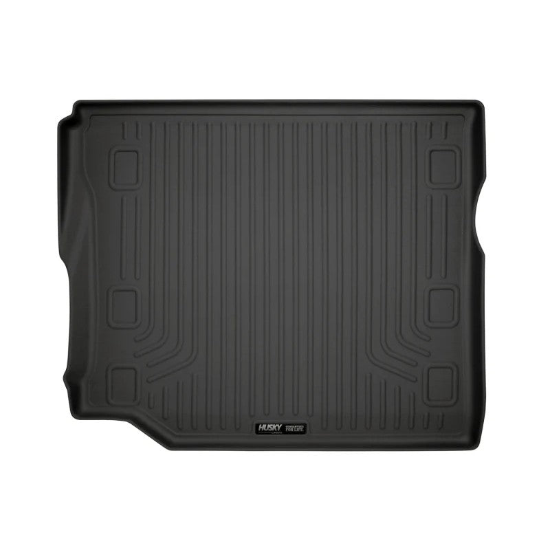 Black Husky Liners WeatherBeater cargo liner with raised edges and StayPut Cleats for Jeep Wrangler and Wagoneer models.