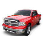 Smoke finish Husky Liners Aeroskin hood protector installed on the front edge of a Ram heavy-duty truck hood.