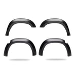 Set of four matte black Husky Liners Extend-A-Fender style fender flares for Ram 2500 and 3500 pickup trucks.