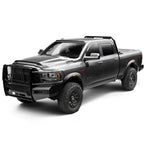 Matte black Husky RVL fender flares with integrated LED lighting and built-in mud flaps on a 2019-2025 Ram 2500.