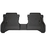 Husky Liners WeatherBeater 2nd seat black floor liners for Jeep Gladiator showing textured surface and StayPut cleats.