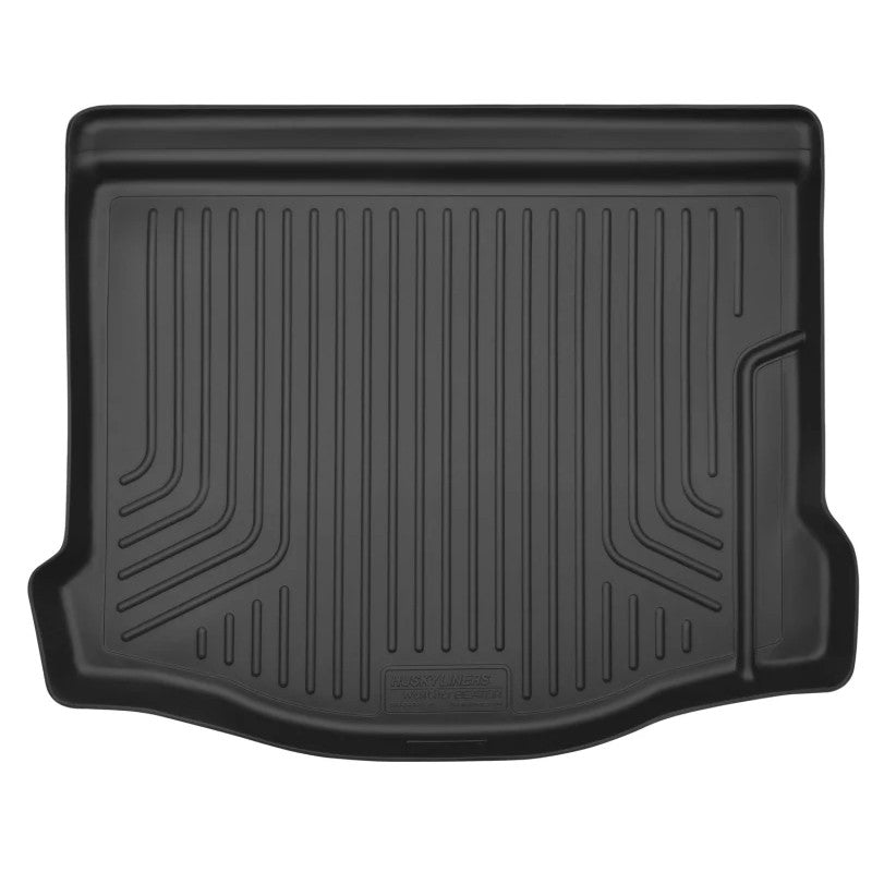 Black Husky Liners WeatherBeater cargo trunk liner for Ford Focus 5-door hatchback showing raised edges and textured surface.