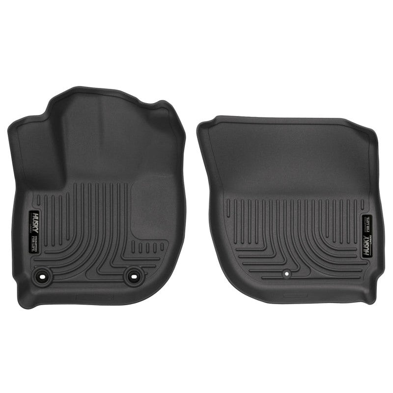 Black Husky Liners Weatherbeater front floor mats for Honda Fit and HR-V showing precision-molded texture and raised edges.
