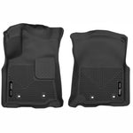 Black Husky X-Act Contour front floor liners for 2018-2023 Toyota Tacoma with textured DuraGrip surface.