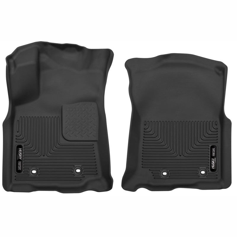 Black Husky X-Act Contour front floor liners for 2018-2023 Toyota Tacoma with textured DuraGrip surface.