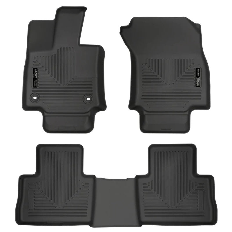 Black Husky Liners Weatherbeater front and second-row floor mats for a 2019-2025 Toyota RAV4.