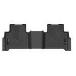 Black Husky Liners X-act Contour second-row floor liner showing textured DuraGrip surface and raised FormFit edges.