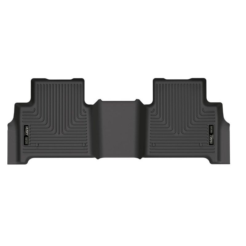 Black Husky Liners X-act Contour second-row floor liner showing textured DuraGrip surface and raised FormFit edges.