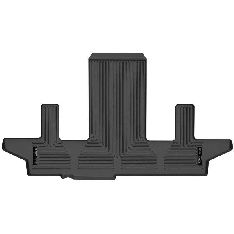 Husky Liners Weatherbeater black 3rd seat floor mat for vehicles with 2nd row bucket seats.