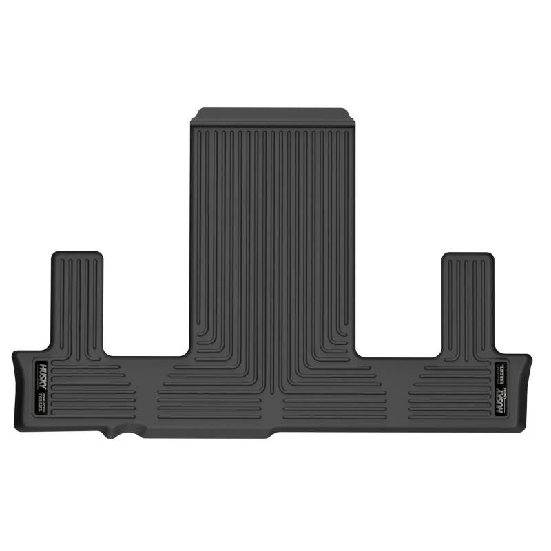 Black Husky Liners Weatherbeater 3rd row floor liner with FormFit Edge and StayPut cleats for 2021-2026 GM SUVs.