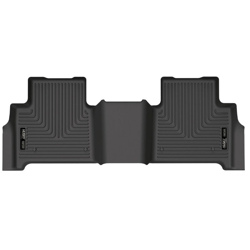 Black Husky Liners WeatherBeater 2nd seat floor liners with FormFit Edge and StayPut Cleats for Jeep and Chevrolet.