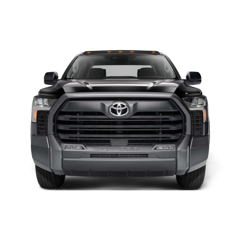 Husky Liners Aeroskin hood protector in dark smoke finish showing low-profile fitment on a vehicle hood.