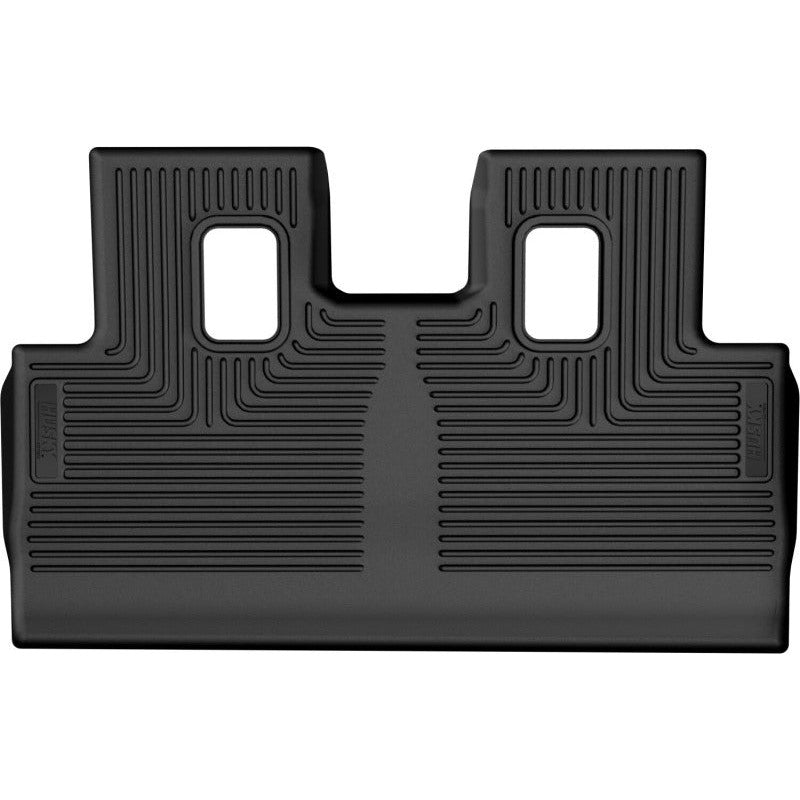 Black Husky Liners WeatherBeater 3rd seat floor liner featuring StayPut cleats and FormFit spill-containment edges.