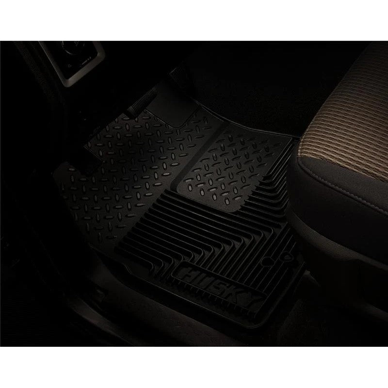 Black Husky Liners Heavy Duty 2nd row floor mats with deep channels, raised ridges, and StayPut Cleats.