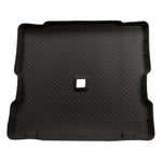 Black Husky Liners Classic Style rear cargo liner with diamond plate texture for 1987-2002 Jeep Wrangler.