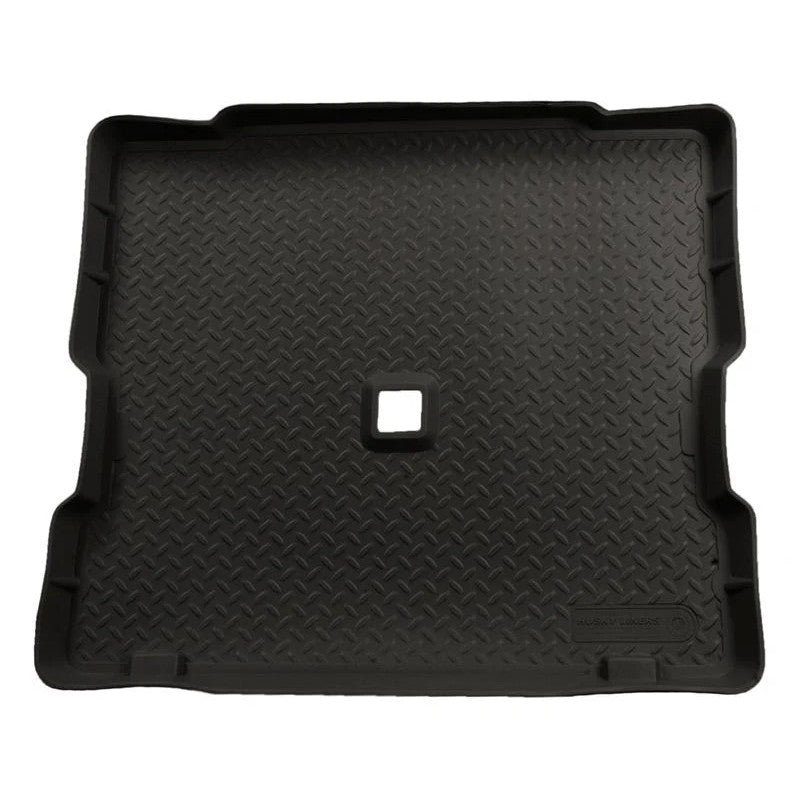 Black Husky Liners Classic Style rear cargo liner with diamond plate texture for 1987-2002 Jeep Wrangler.