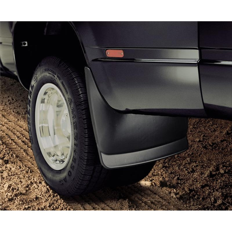 Husky Liners black custom-molded rear dually mud guards for 1988-2000 Chevrolet and GMC 3500 trucks.