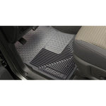 Black Husky Liners Heavy Duty front floor mats for 1967-2009 trucks and SUVs featuring deep ridges and StayPut Cleats.