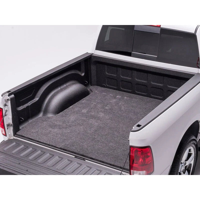 Husky Liners Guardian Comfort 66x98 inch universal trim-to-fit polypropylene truck bed mat with a gray carpet-style texture.